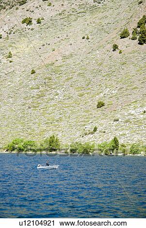 Person in boat on lake View Large Photo Image Stock Image - Person in boat on lake. Fotosearch