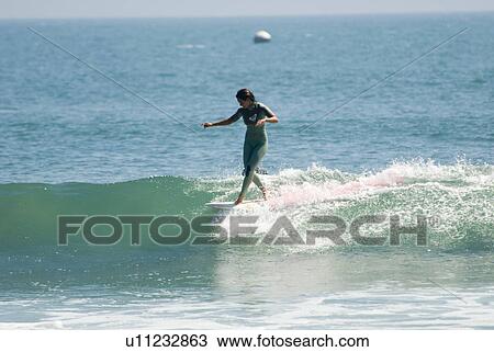Stock Image - Professional surfer. Fotosearch