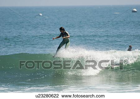Stock Image - Professional surfer. Fotosearch