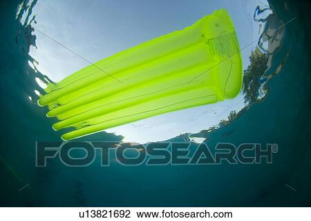 Raft floating in a pool View Large Photo Image Stock Image - Raft floating in a pool. Fotosearch
