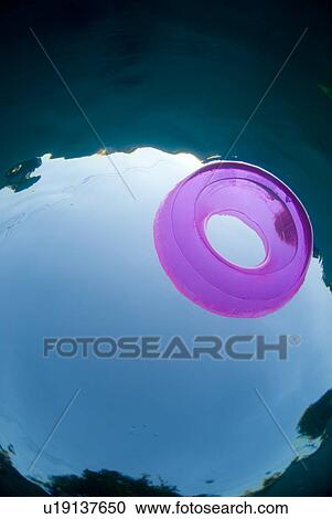 Raft floating in a pool View Large Photo Image Stock Image - Raft floating in a pool. Fotosearch