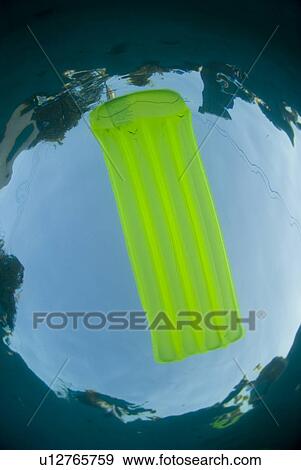 Stock Photo - Raft floating in a pool. Fotosearch