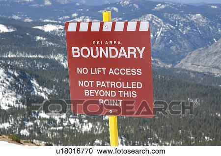 Stock Image - Ski area boundary sign. Fotosearch
