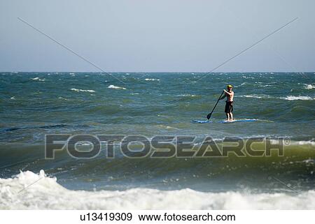 Stock Photo - Stand up surfer. Fotosearch