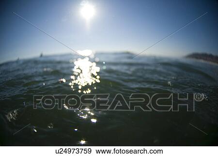Stock Photo - Sun on the ocean. Fotosearch