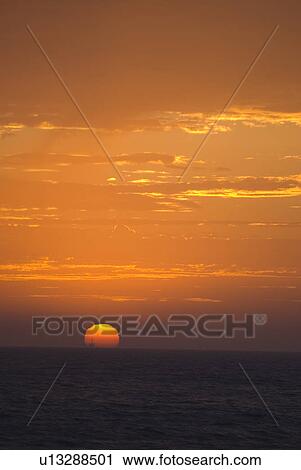 Sunset over the ocean View Large Photo Image Stock Image - Sunset over the ocean. Fotosearch