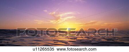Sunset over the water View Large Photo Image Stock Photography - Sunset over the water. Fotosearch