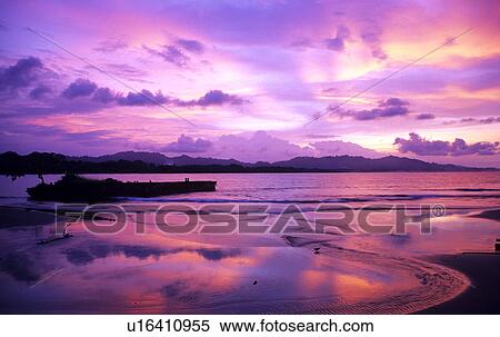 Stock Photography - Sunset through clouds. Fotosearch