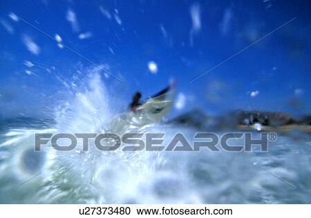 Surfer doing air in the water View Large Photo Image Stock Image - Surfer doing air in the water. Fotosearch