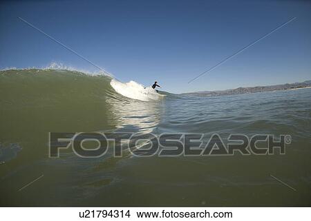 Picture - Surfer on a wave. Fotosearch