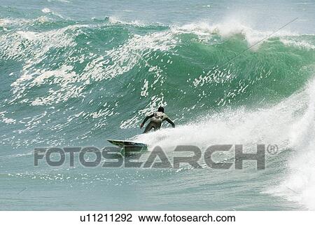 Surfer surfing View Large Photo Image Stock Image - Surfer surfing. Fotosearch