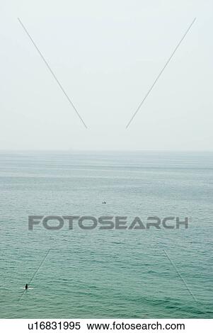 Surfer waiting for a wave View Large Photo Image Stock Photography - Surfer waiting for a wave. Fotosearch