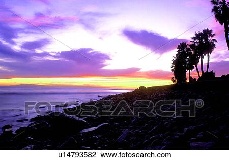 Stock Image - The coast at sunset. Fotosearch