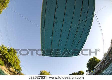 Stock Image - The under side of a diving board in a pool. Fotosearch
