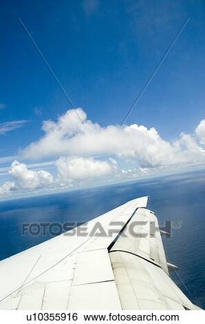 The view out an airplane window View Large Photo Image Stock Photograph - The view out an airplane window. Fotosearch