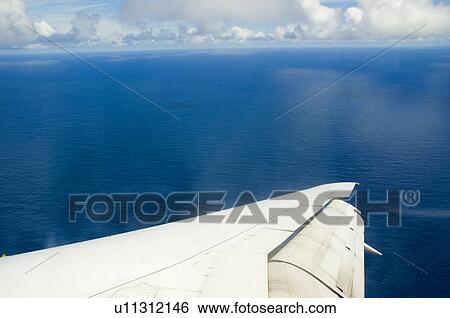 Stock Photograph - The view out an airplane window. Fotosearch