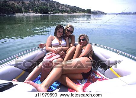 Stock Image - Three ladies in bikinis. Fotosearch