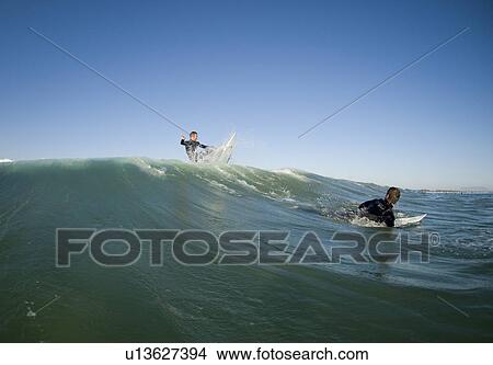 Two surfers View Large Photo Image Picture - Two surfers. Fotosearch