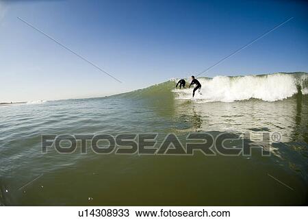 Stock Image - Two surfers. Fotosearch