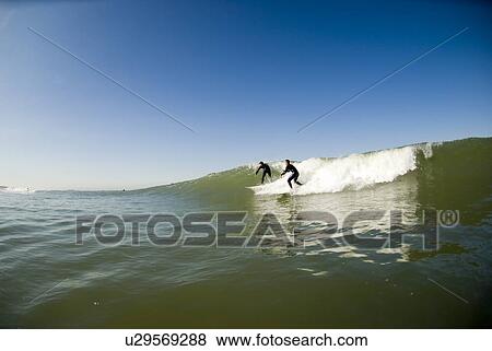 Two surfers View Large Photo Image Stock Photo - Two surfers. Fotosearch