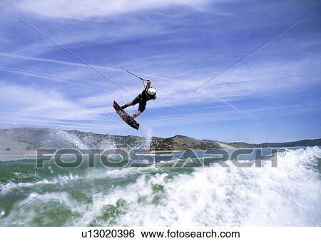 Wakeboarder in action View Large Photo Image Stock Photograph - Wakeboarder in action. Fotosearch