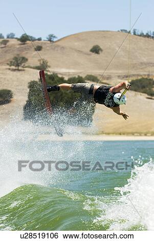 Wakeboarder in action View Large Photo Image Stock Photograph - Wakeboarder in action. Fotosearch