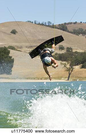 Wakeboarder in midair View Large Photo Image Stock Image - Wakeboarder in midair. Fotosearch