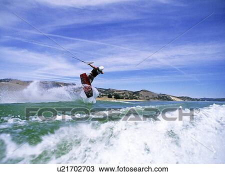 Wakeboarder in twist View Large Photo Image Stock Image - Wakeboarder in twist. Fotosearch