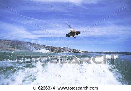 Picture - Wakeboarder parallel to water. Fotosearch