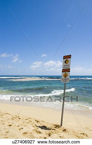 Stock Photo - Warning sign rip currents and high waves. Fotosearch