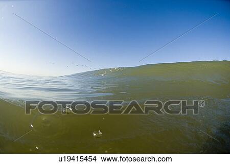 Waves breaking in the ocean View Large Photo Image Picture - Waves breaking in the ocean. Fotosearch