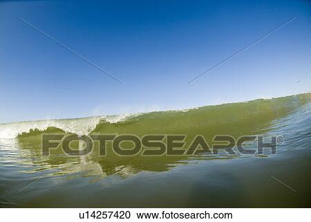 Waves breaking in the ocean View Large Photo Image Stock Image - Waves breaking in the ocean. Fotosearch