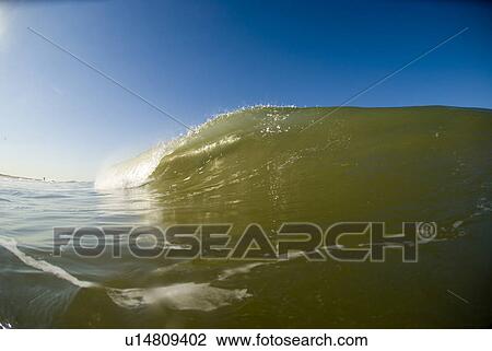 Stock Image - Waves breaking in the ocean. Fotosearch