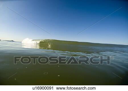 Stock Image - Waves breaking in the ocean. Fotosearch