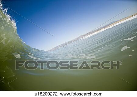 Stock Image - Waves breaking in the ocean. Fotosearch