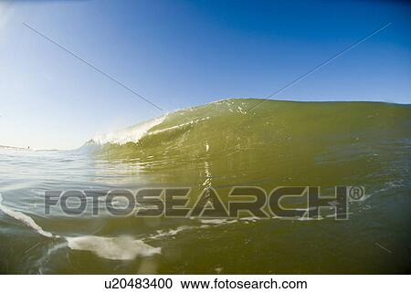Stock Image - Waves breaking in the ocean. Fotosearch