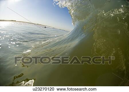 Stock Image - Waves breaking in the ocean. Fotosearch