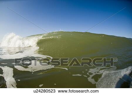 Waves breaking in the ocean View Large Photo Image Stock Image - Waves breaking in the ocean. Fotosearch