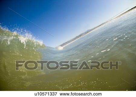 Stock Photo - Waves breaking in the ocean. Fotosearch