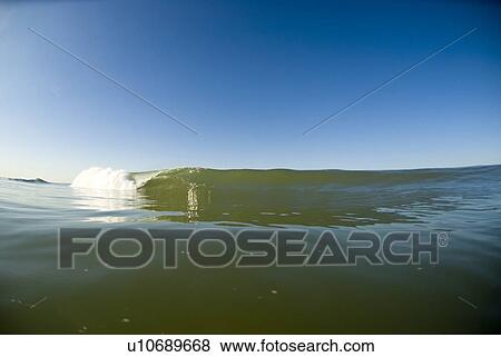 Stock Photo - Waves breaking in the ocean. Fotosearch