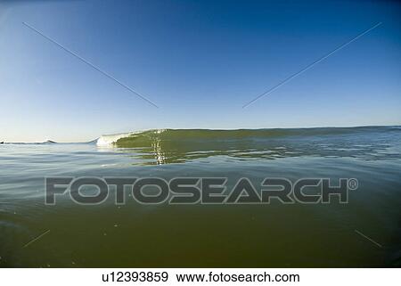 Stock Photo - Waves breaking in the ocean. Fotosearch