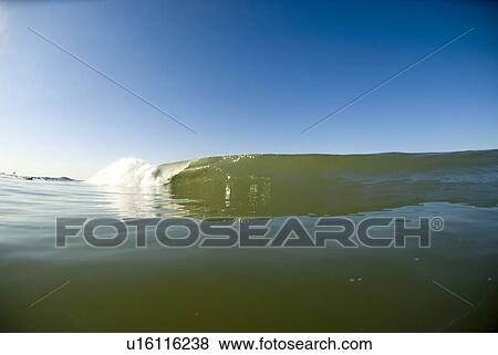 Waves breaking in the ocean View Large Photo Image Stock Photo - Waves breaking in the ocean. Fotosearch