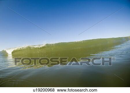 Waves breaking in the ocean View Large Photo Image Stock Photo - Waves breaking in the ocean. Fotosearch