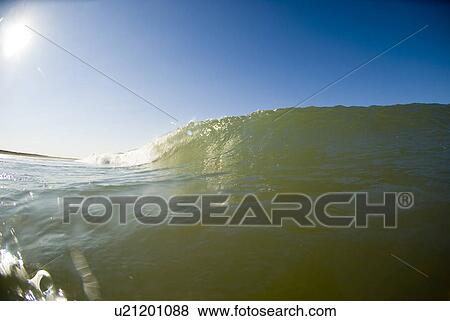 Waves breaking in the ocean View Large Photo Image Stock Photo - Waves breaking in the ocean. Fotosearch