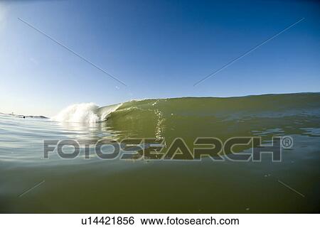 Stock Photograph - Waves breaking in the ocean. Fotosearch