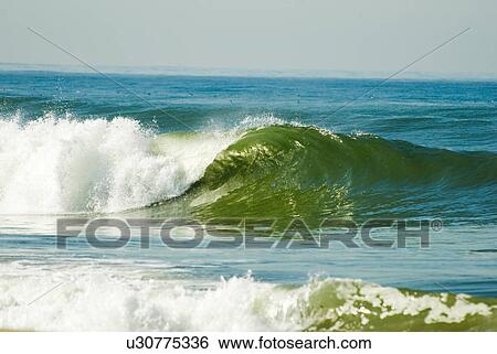 Waves breaking in the ocean View Large Photo Image Stock Photograph - Waves breaking in the ocean. Fotosearch
