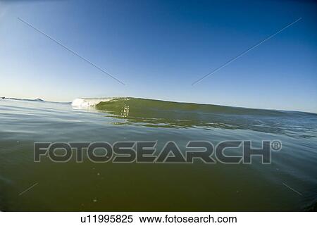 Waves breaking in the ocean View Large Photo Image Stock Photography - Waves breaking in the ocean. Fotosearch