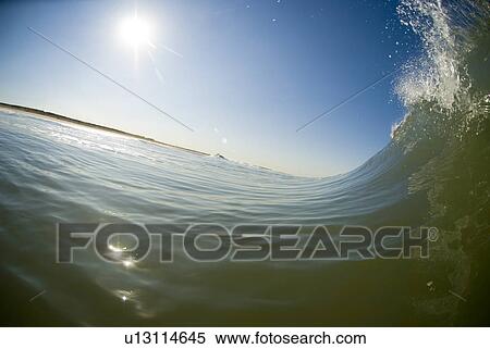 Waves breaking in the ocean View Large Photo Image Stock Photography - Waves breaking in the ocean. Fotosearch