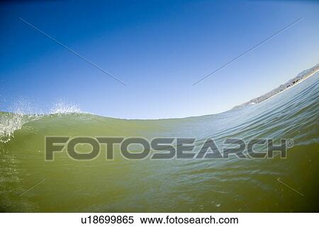 Stock Photography - Waves breaking in the ocean. Fotosearch