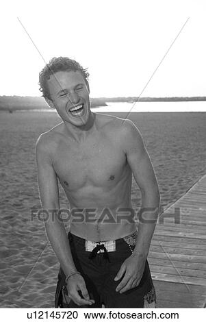 Young male laughing View Large Photo Image Stock Image - Young male laughing. Fotosearch